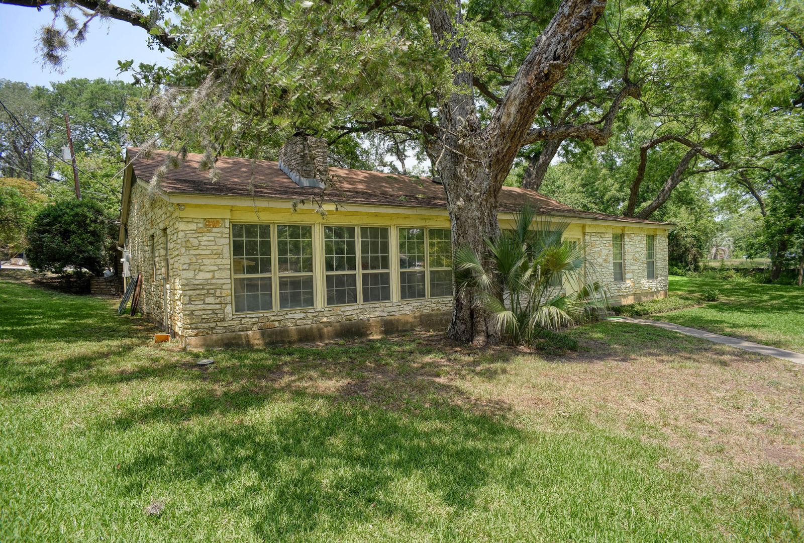 4703 Laguna Lane Austin, TX 78746 - Photo 20 of 32 a view of front of a house with a yard