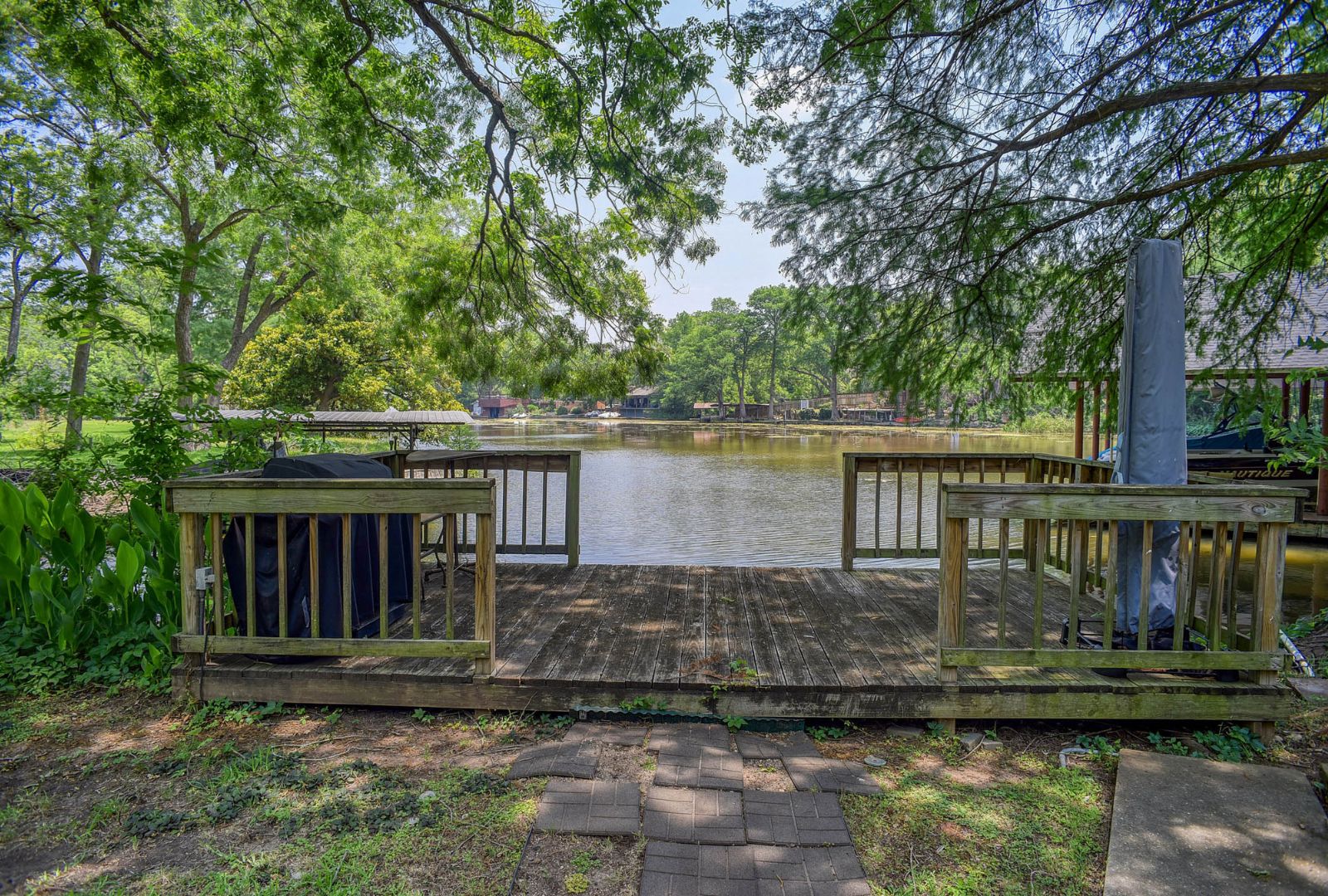 4703 Laguna Lane Austin, TX 78746 - Photo 21 of 32 a front view of a house with a yard