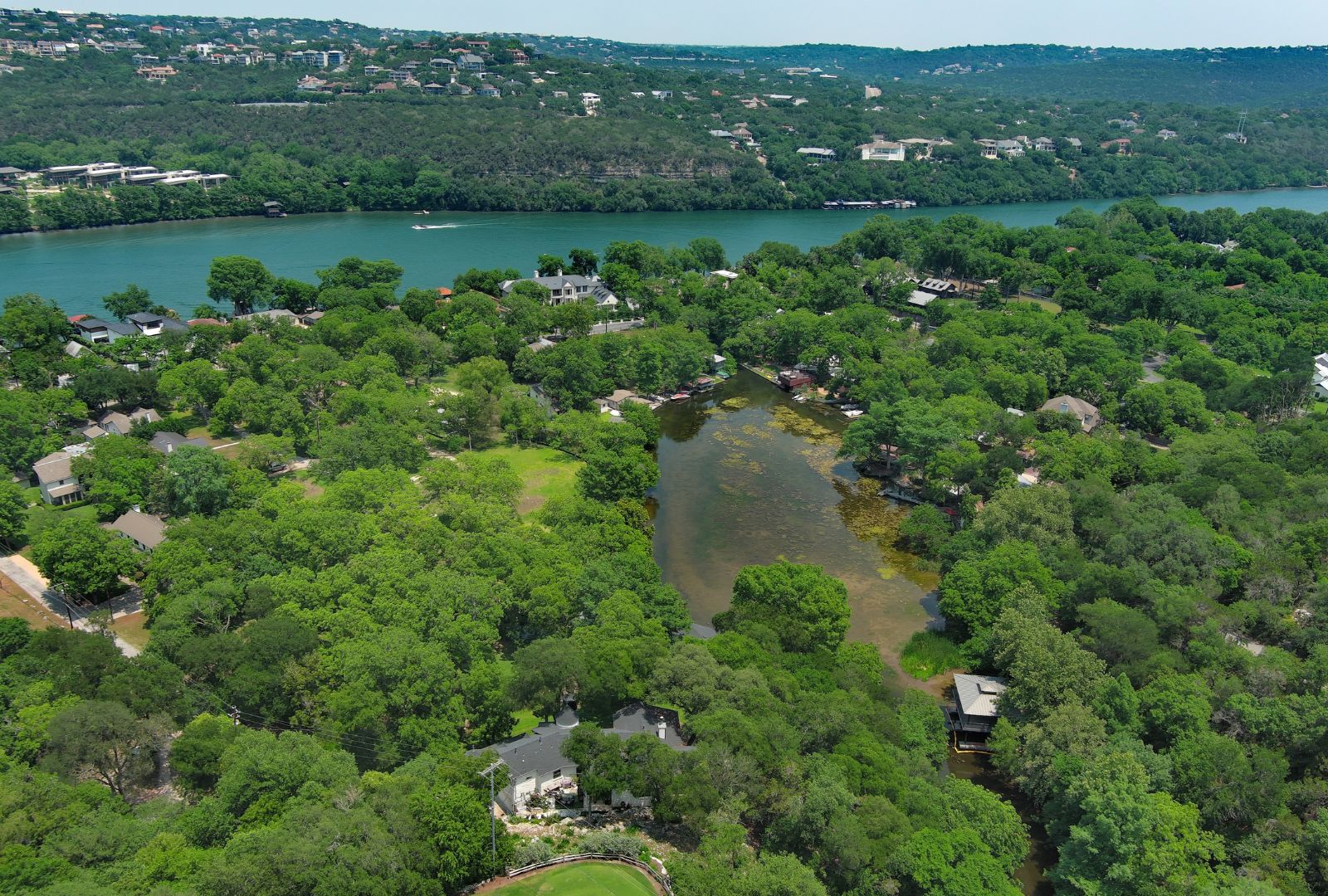 4703 Laguna Lane Austin, TX 78746 - Photo 25 of 32 an aerial view of a houses with outdoor space and lake view