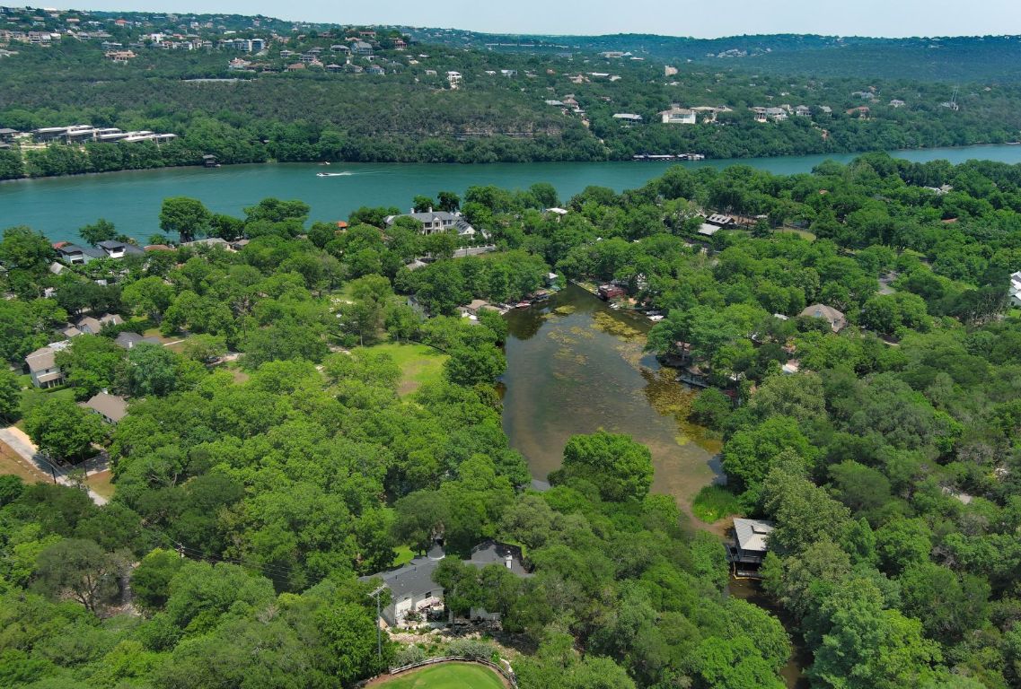 4703 Laguna Lane Austin, TX 78746 - Photo 25 of 32 an aerial view of a houses with outdoor space and trees