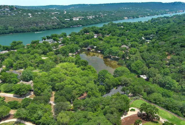 a view of lake with green space