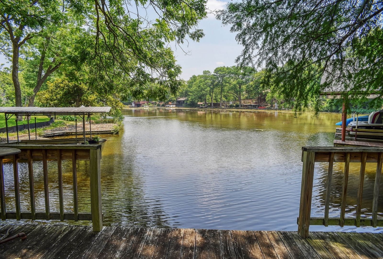 4703 Laguna Lane Austin, TX 78746 - Photo 4 of 32 a view of a wooden deck