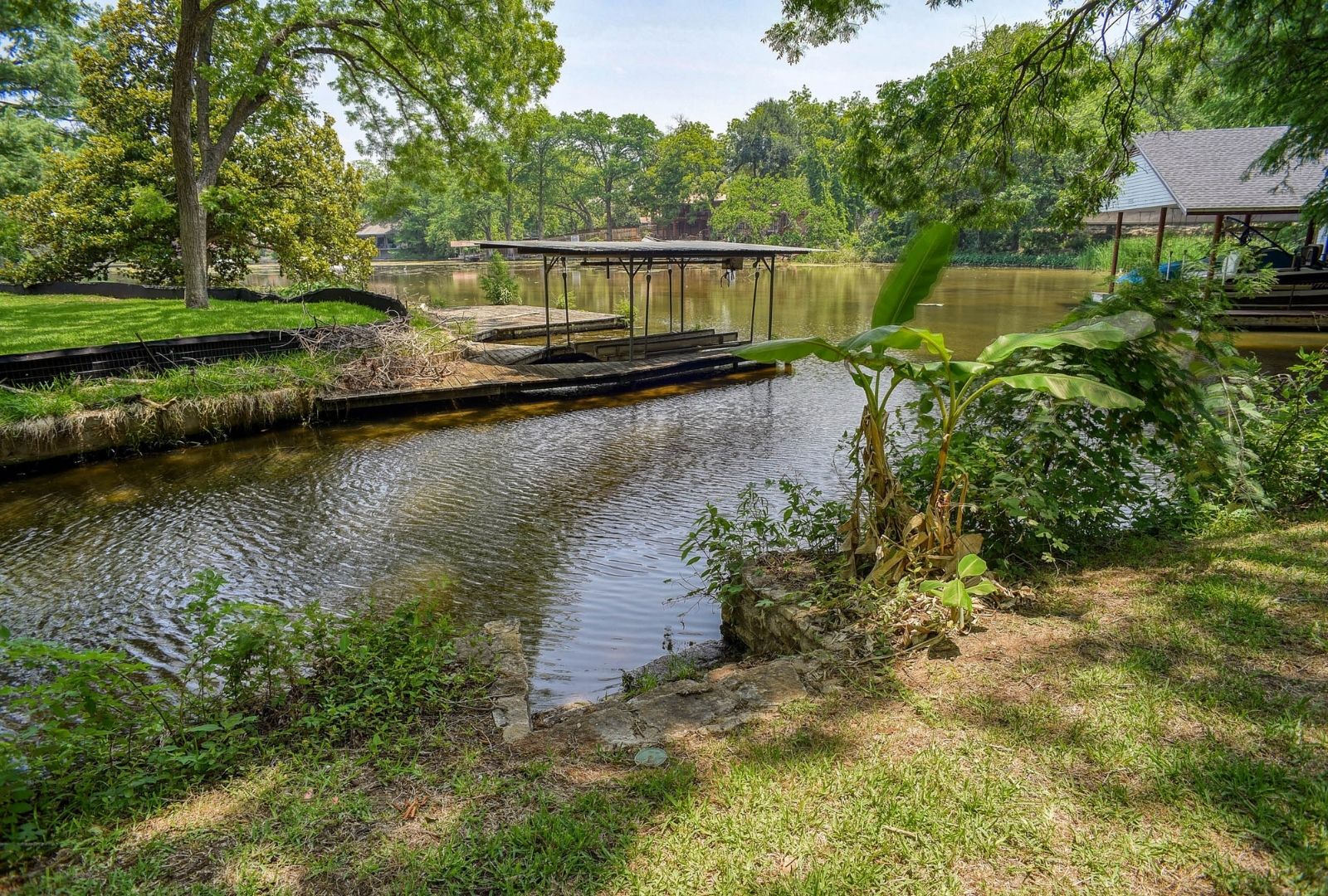 4703 Laguna Lane Austin, TX 78746 - Photo 5 of 32 a view of a house with a yard