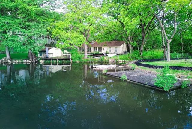 a view of a chair and table on the garden