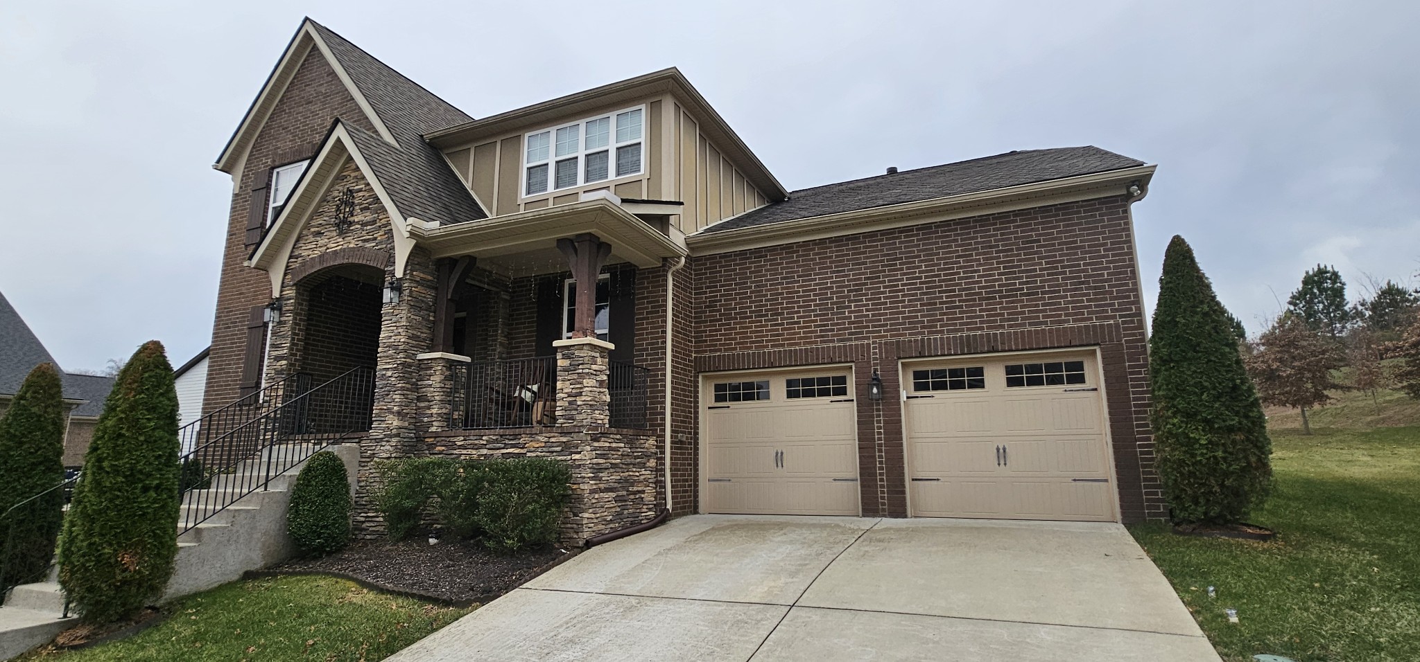 a front view of a house with garden