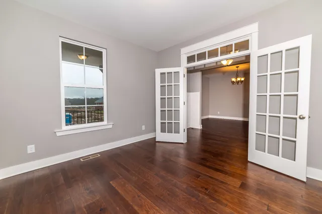 a view of livingroom with furniture wooden floor and windows