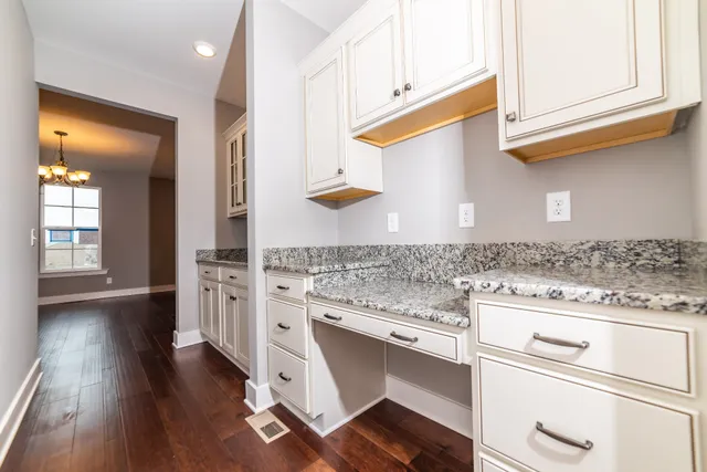 a kitchen with stainless steel appliances granite countertop a stove and a sink
