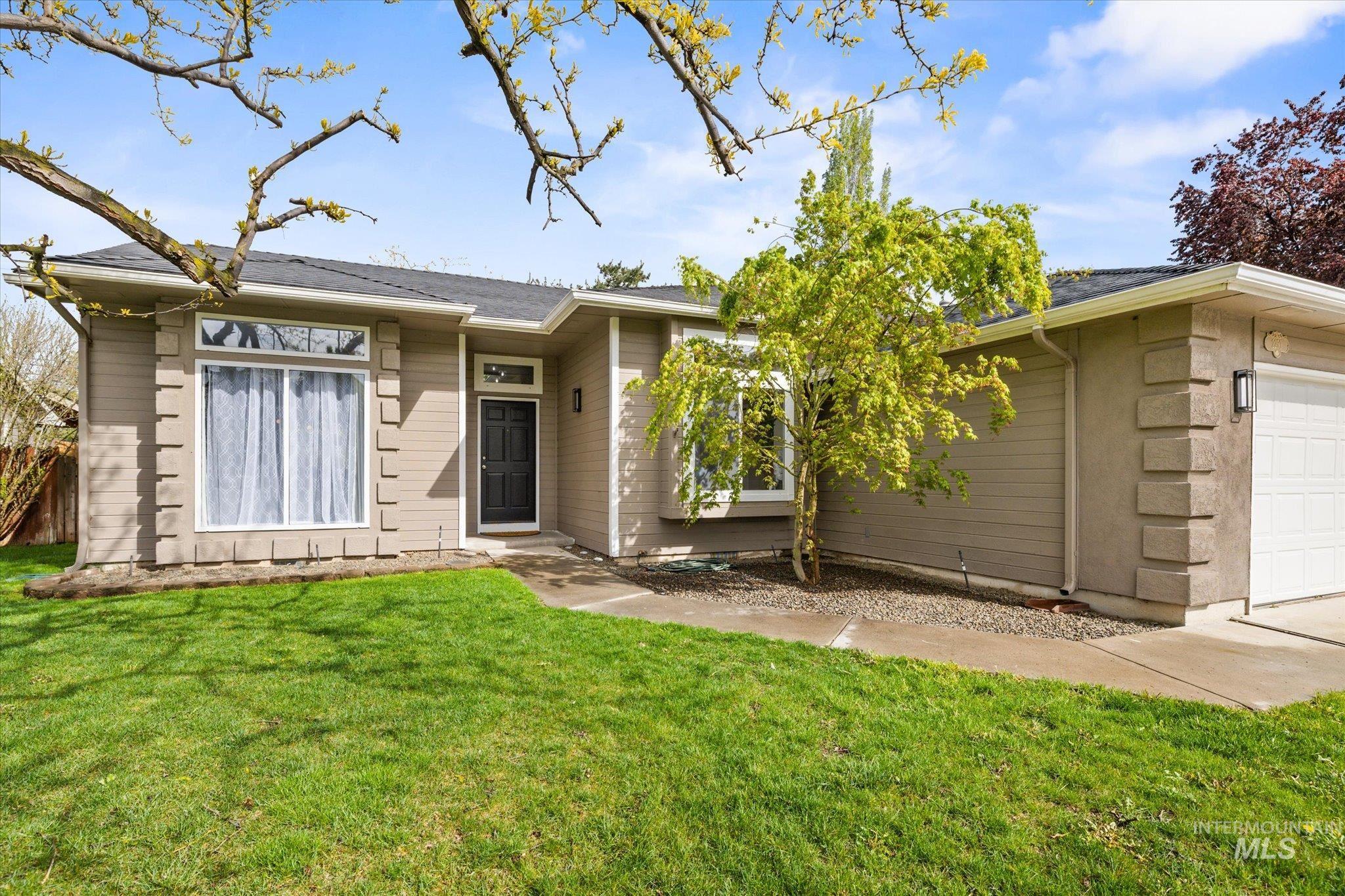 2250 North Amethyst Avenue Meridian, ID 83646 - Photo 3 of 50 View of front of property with a garage and a front yard