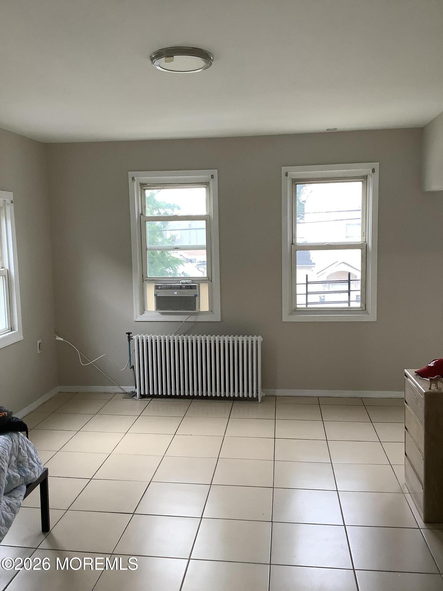 242 1st Street Keyport, NJ 07735 - Photo 14 of 23 a view of a room with a window and a ceiling fan