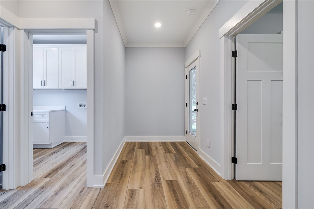 2014 Marshview Drive Northeast Townsend, GA 31331 - Photo 18 of 59 Hallway to back porch, laundry, powder room & primary suite