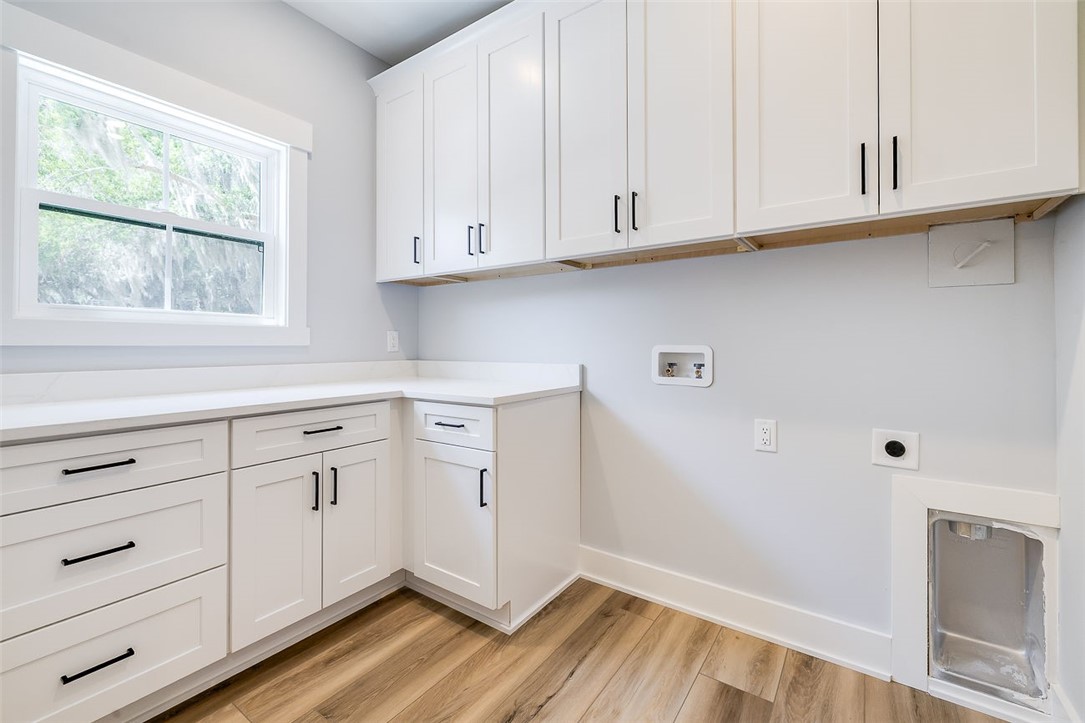 2014 Marshview Drive Northeast Townsend, GA 31331 - Photo 20 of 59 Laundry with cabinets for days! and counters!