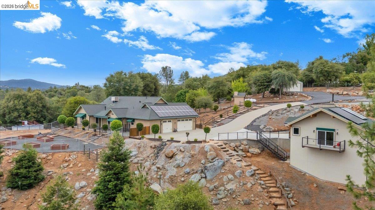 18180 Robin Ridge Road Sonora, CA 95370 - Photo 2 of 88 Expansive property featuring a main residence with a two-car garage and solar panels