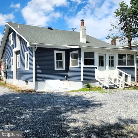 a front view of a house with a patio