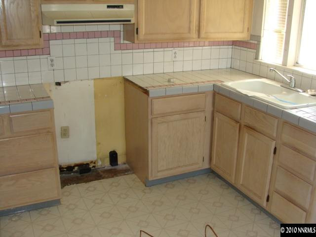 1570 Harvard Way Reno, NV 89502 - Photo 4 of 7 a bathroom with a sink and a shower