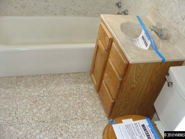 1570 Harvard Way Reno, NV 89502 - Photo 6 of 7 a bathroom with a sink and toilet