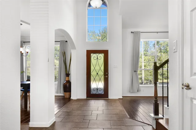 a view of an entryway with wooden floor
