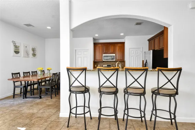 a dinning room and chairs in a room