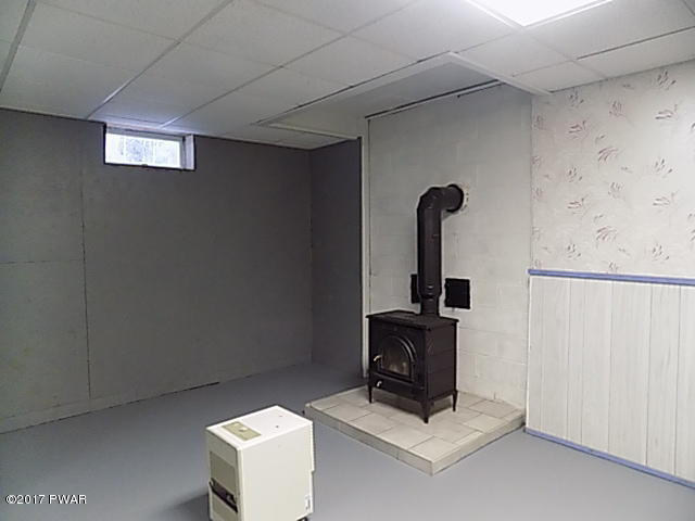 72 Schelbert Road Newfoundland, PA 18445 - Photo 33 of 55 Basement with Woodstove