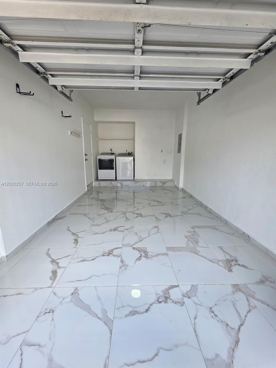 10245 Southwest 154th Place, Unit 1123 Miami, FL 33196 - Photo 30 of 38 a view of a garage