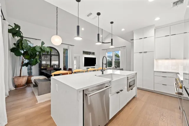 a kitchen with a stove and a sink