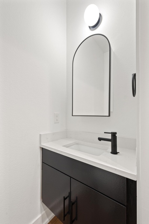 2104 East 2nd Street, Unit 1 Austin, TX 78702 - Photo 14 of 39 a bathroom with a sink and a mirror