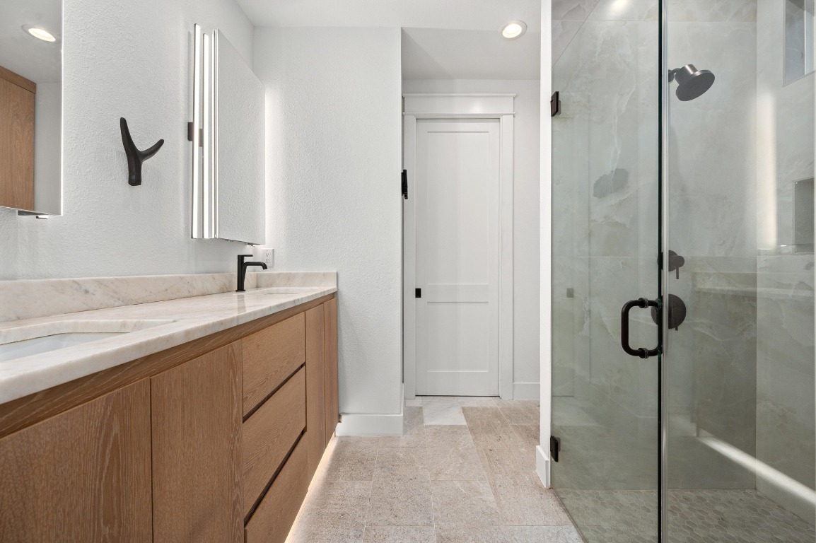 2104 East 2nd Street, Unit 1 Austin, TX 78702 - Photo 16 of 39 a bathroom with a double vanity sink mirror and shower
