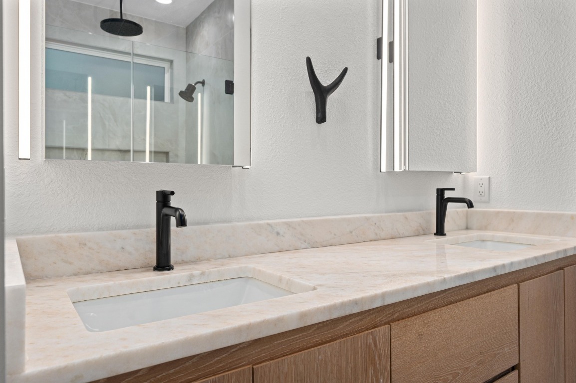 2104 East 2nd Street, Unit 1 Austin, TX 78702 - Photo 17 of 39 a bathroom with a sink and a mirror