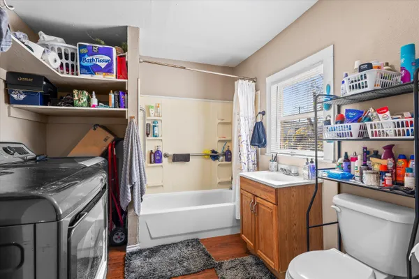 a bathroom with a sink a vanity and a toilet