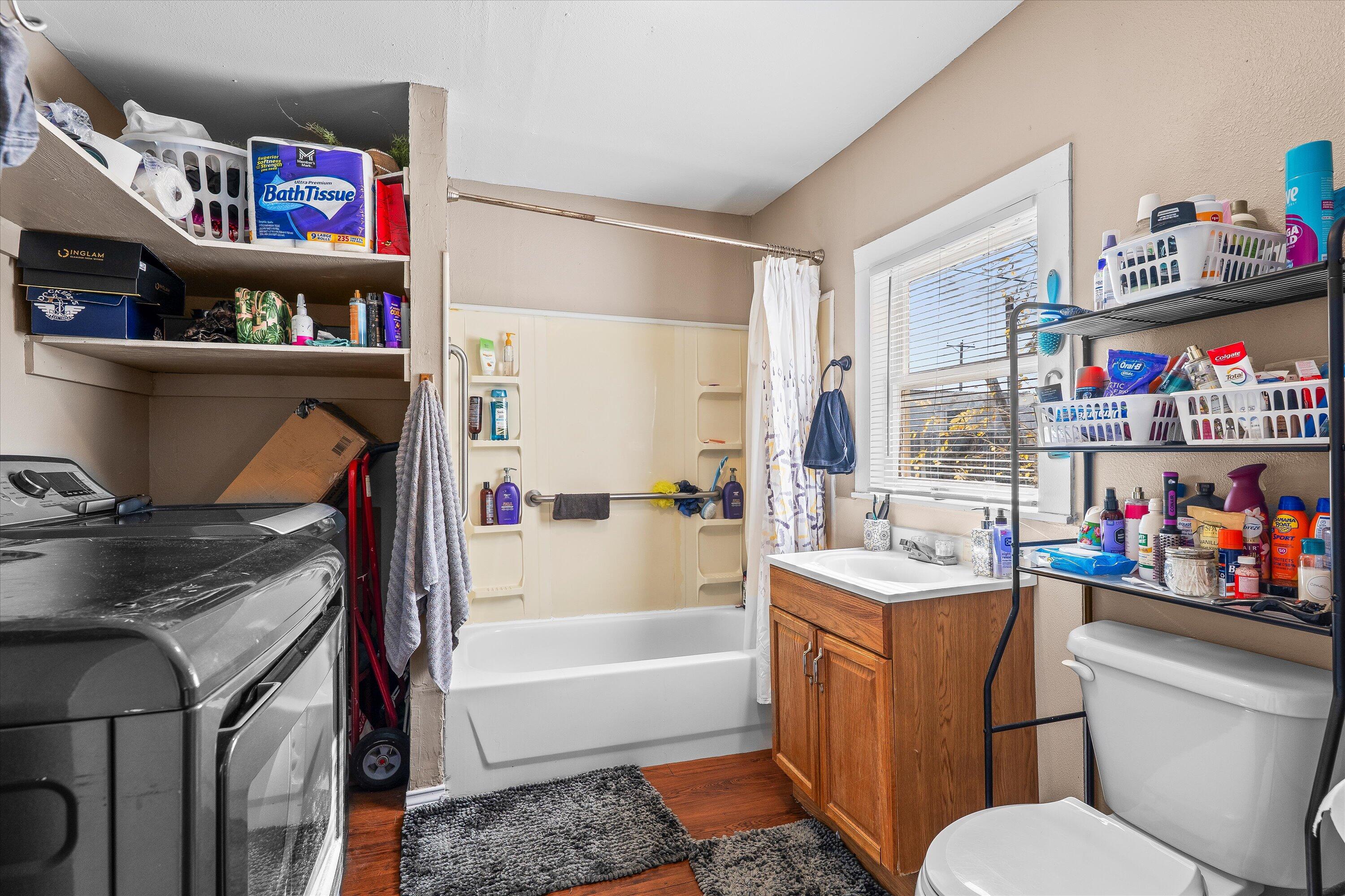 204 Austin Street Levelland, TX 79336 - Photo 11 of 13 a bathroom with a sink a vanity and a toilet