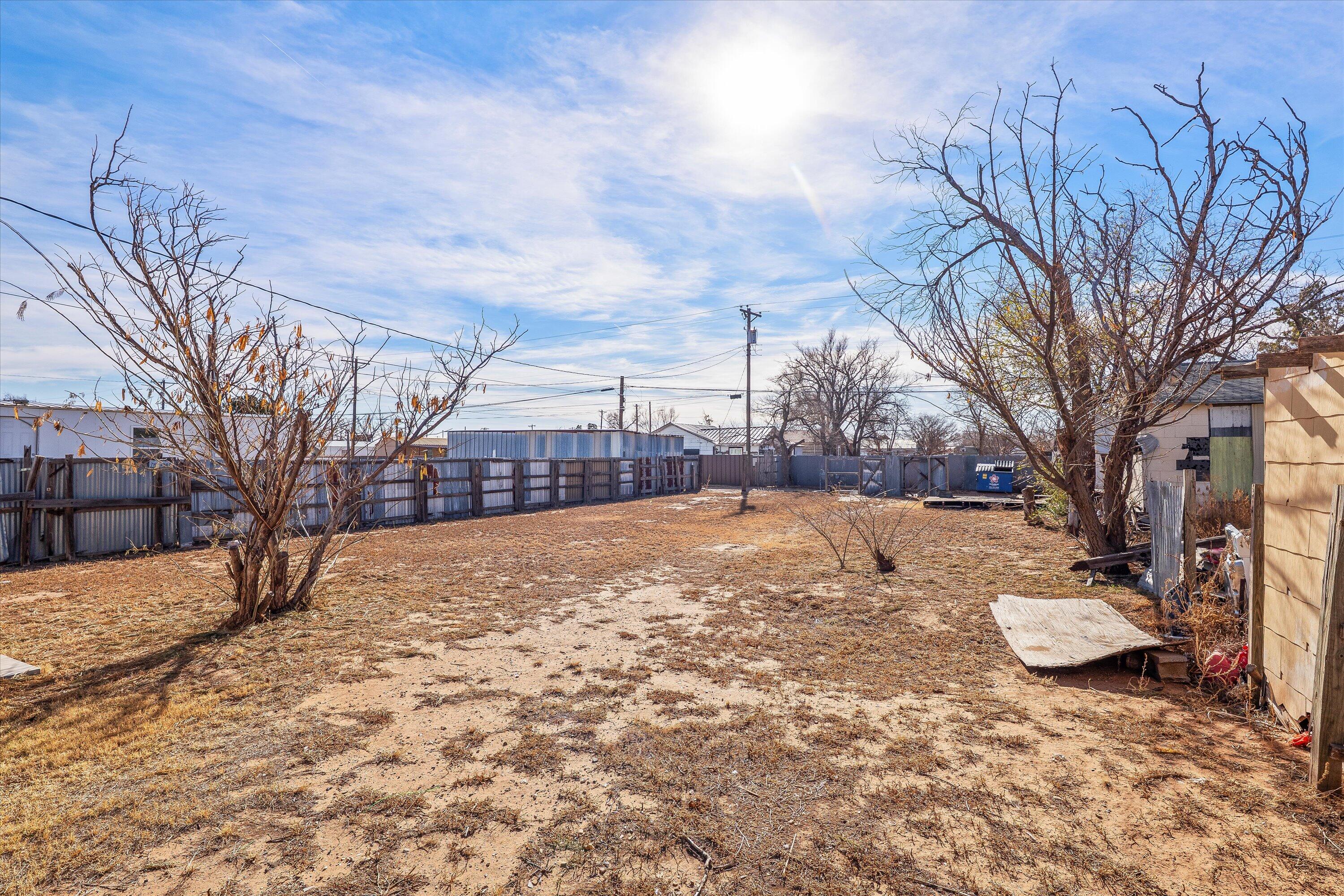 204 Austin Street Levelland, TX 79336 - Photo 12 of 13 a view of a yard with snow on the road