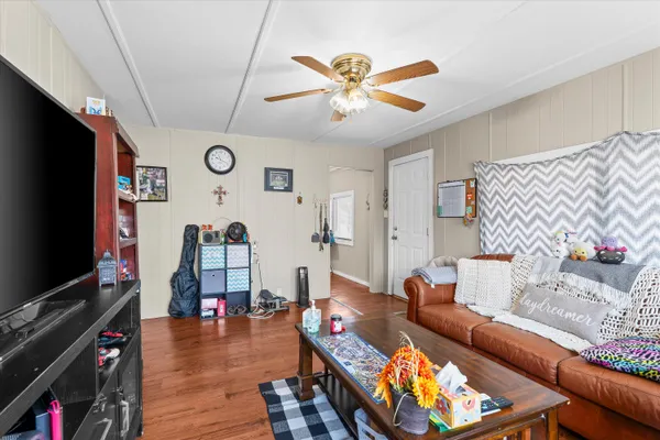 a living room with furniture and a flat screen tv