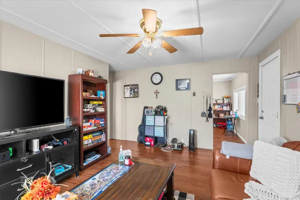 a living room with furniture and a flat screen tv