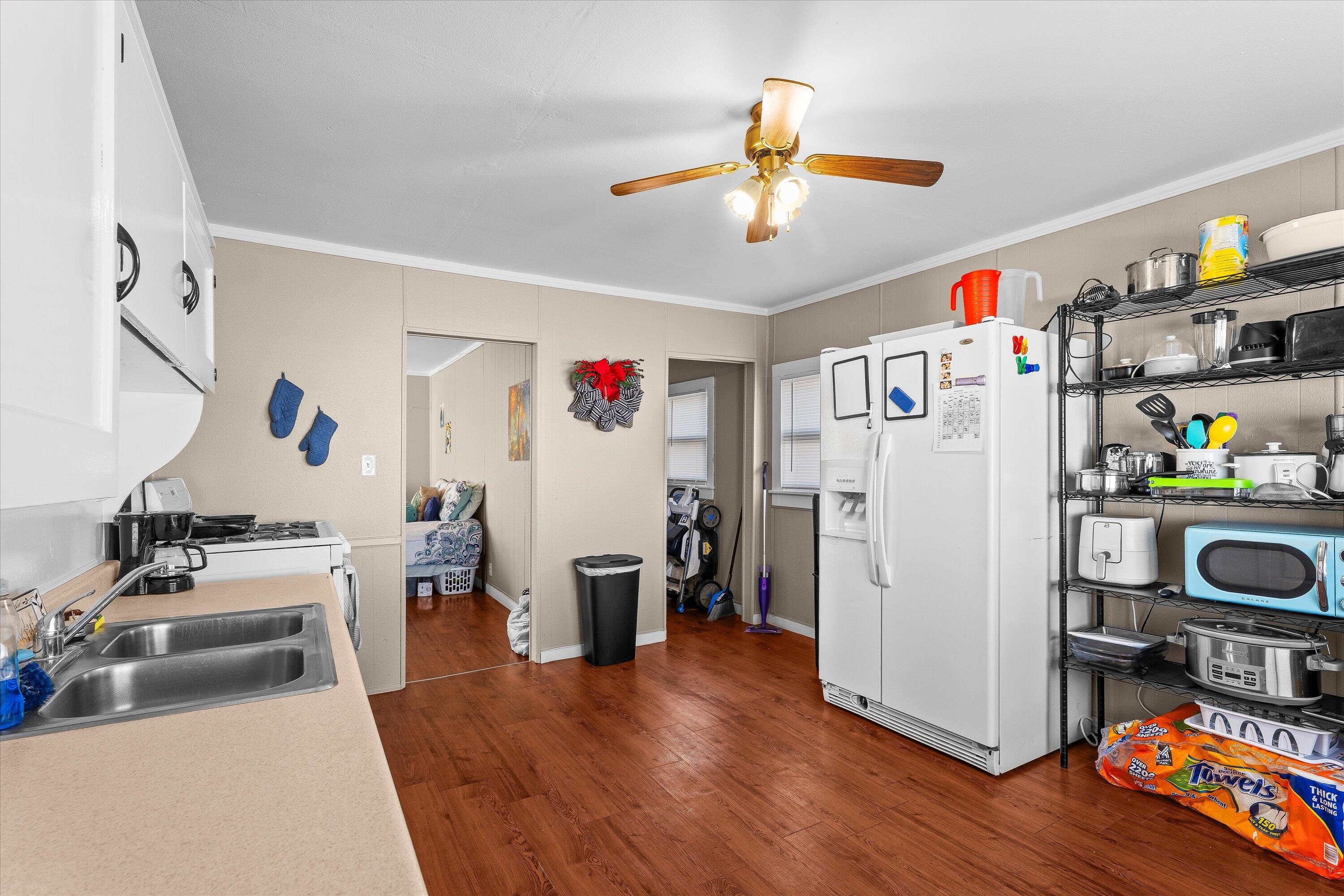 204 Austin Street Levelland, TX 79336 - Photo 6 of 13 a living room with furniture and a wooden floor