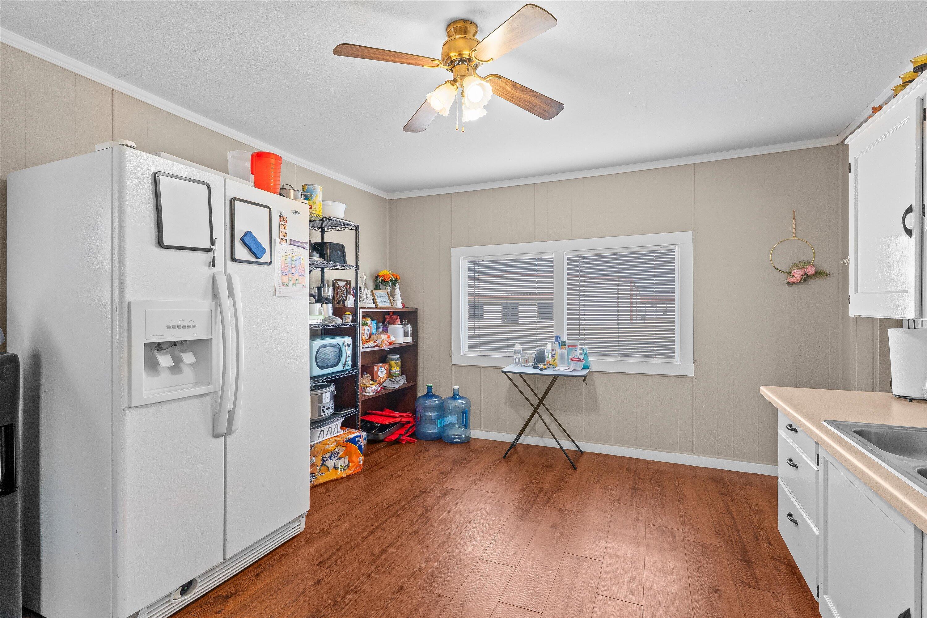 204 Austin Street Levelland, TX 79336 - Photo 8 of 13 a view of a livingroom with workspace and a window