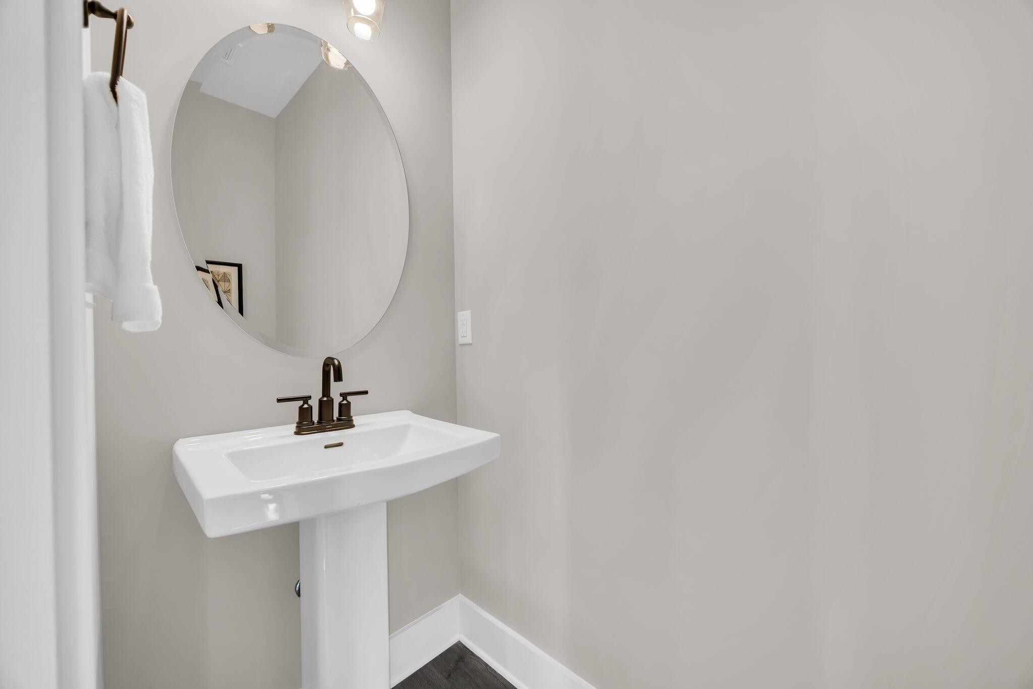 2413 East 17th Street Chattanooga, TN 37404 - Photo 23 of 42 a bathroom with a sink and a mirror