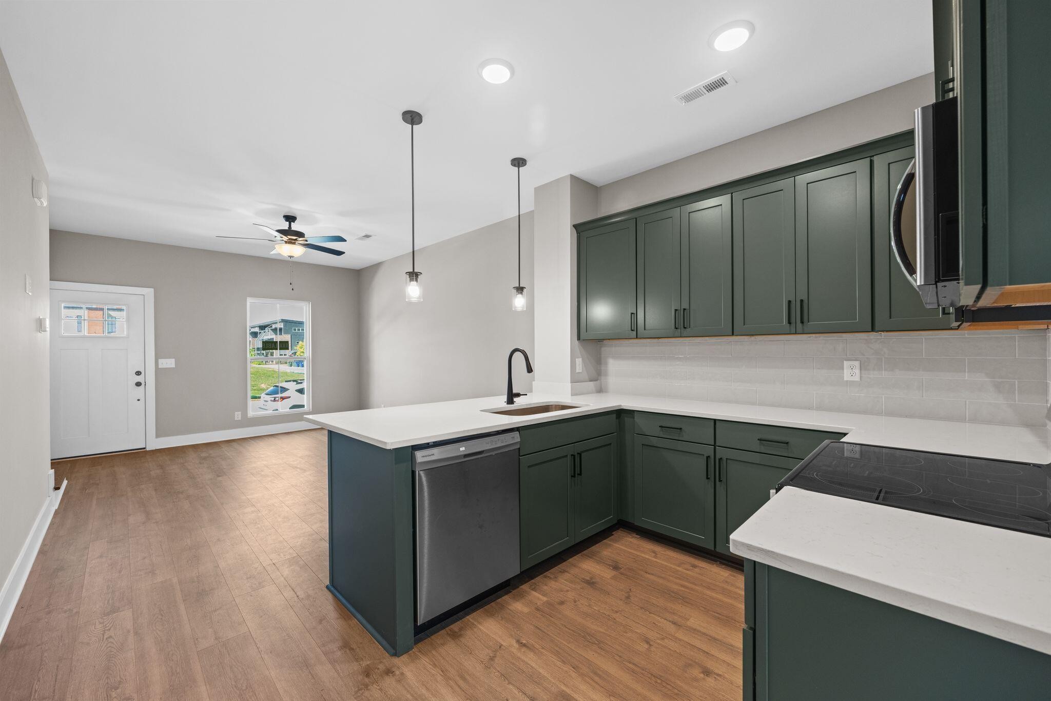 2413 East 17th Street Chattanooga, TN 37404 - Photo 9 of 42 a kitchen with a sink and cabinets