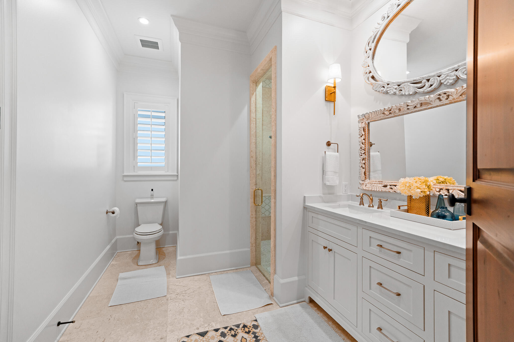 756 Blue Mountain Road Santa Rosa Beach, FL 32459 - Photo 54 of 86 a spacious bathroom with a granite countertop sink mirror and toilet