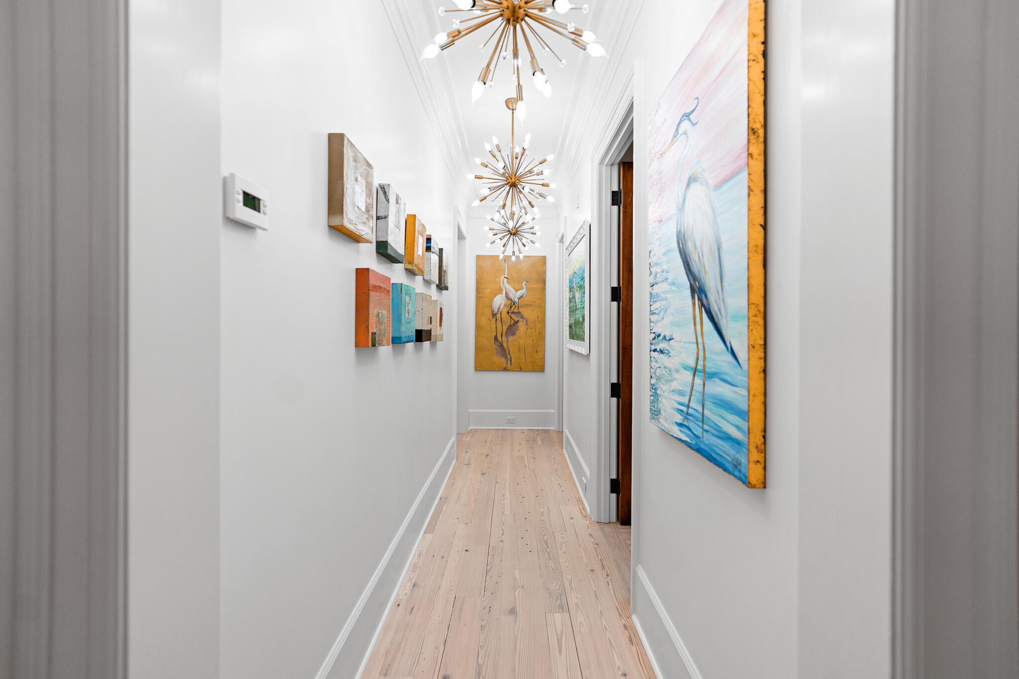756 Blue Mountain Road Santa Rosa Beach, FL 32459 - Photo 57 of 86 a view of a hallway with wooden floor and staircase