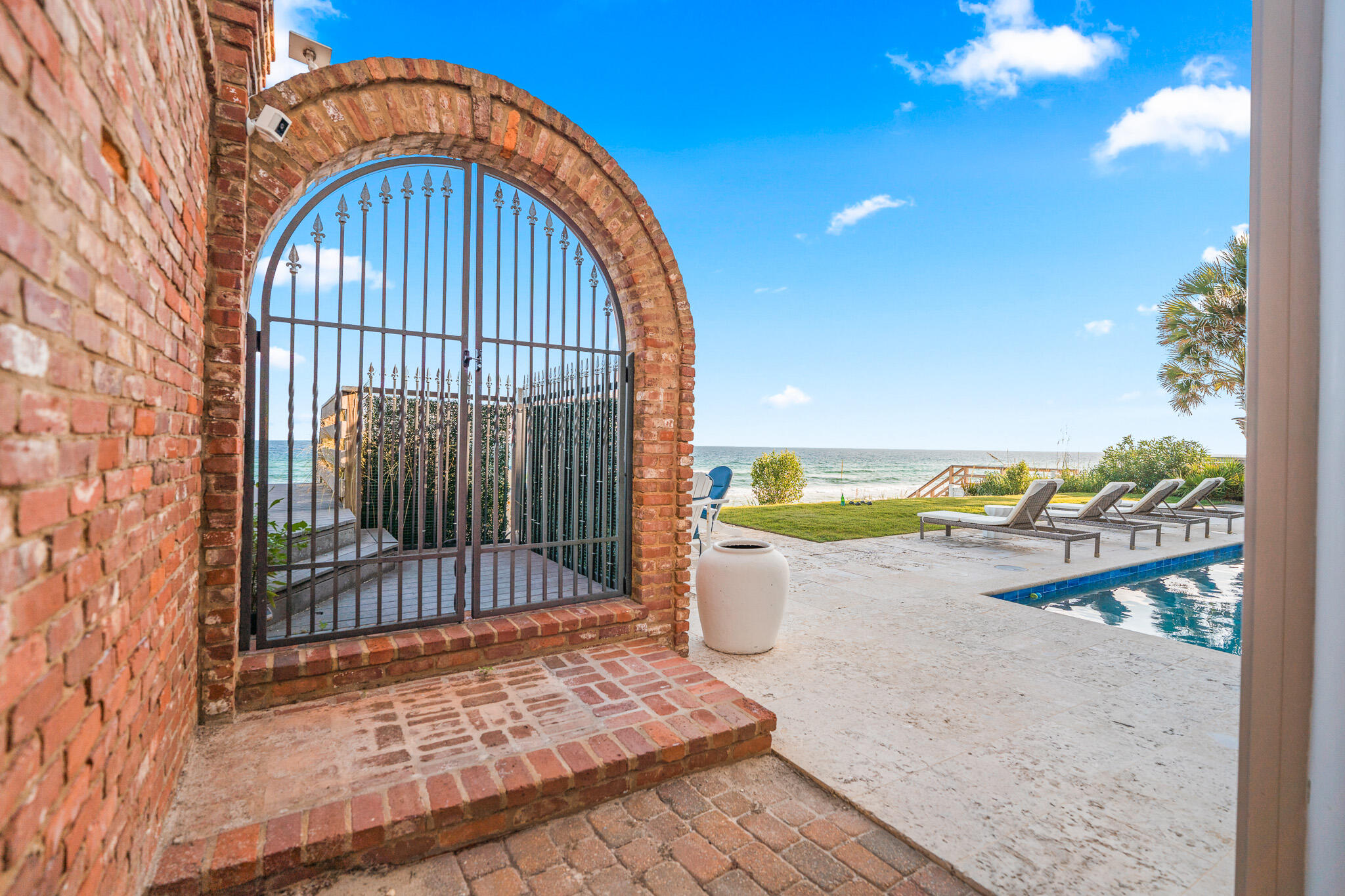 756 Blue Mountain Road Santa Rosa Beach, FL 32459 - Photo 6 of 86 a view of a brick house with a outdoor space