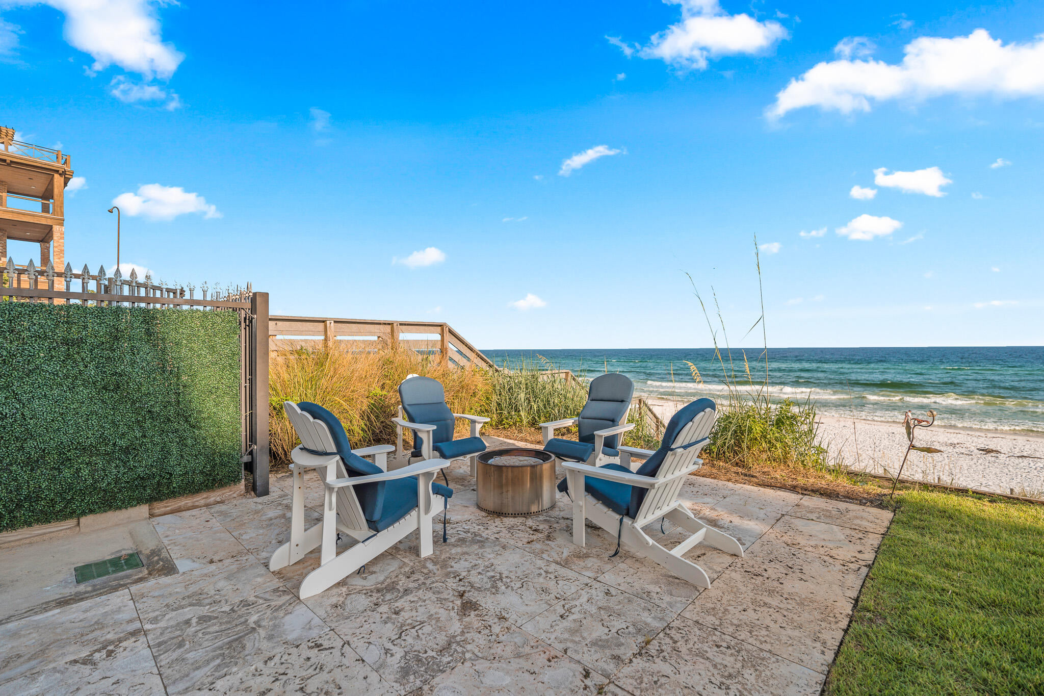 756 Blue Mountain Road Santa Rosa Beach, FL 32459 - Photo 72 of 86 a view of a swimming pool with lawn chairs and a fire pit