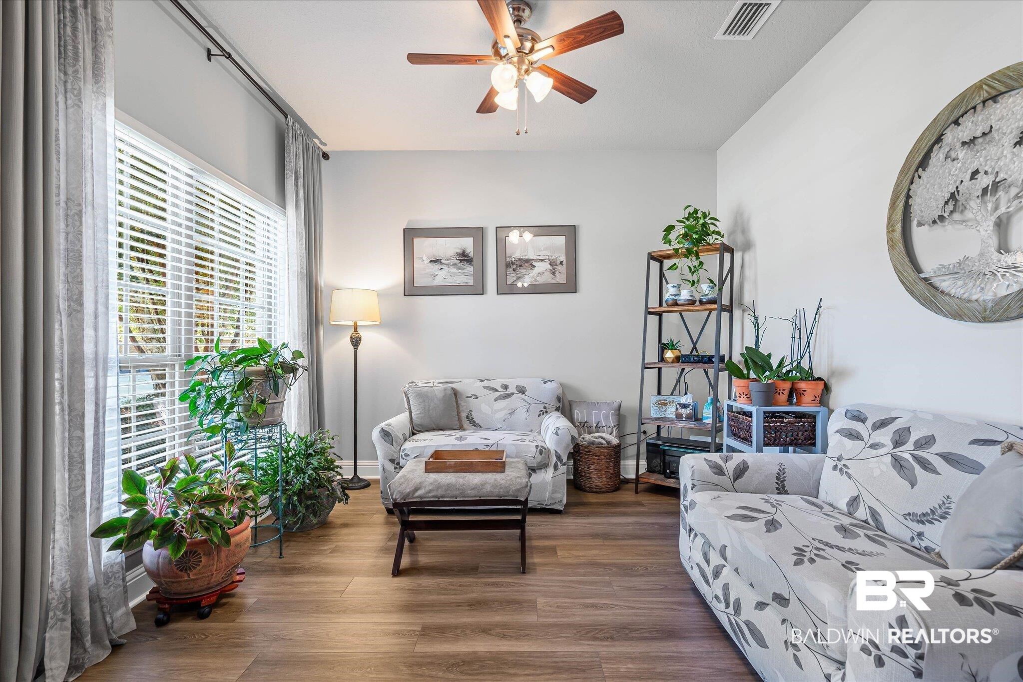 10677 Orkney Way Spanish Fort, AL 36527 - Photo 4 of 22 Sitting room with dark wood-type flooring and a ceiling fan