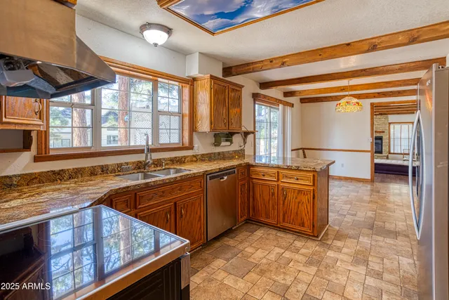 a living room with furniture and a book shelf