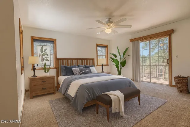 a dining room with furniture a chandelier and wooden floor