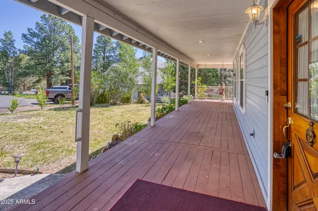 a view of balcony with wooden floor