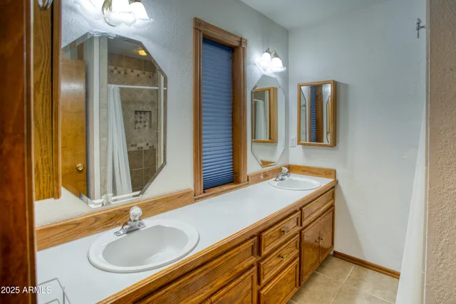 an empty room with closet and a window