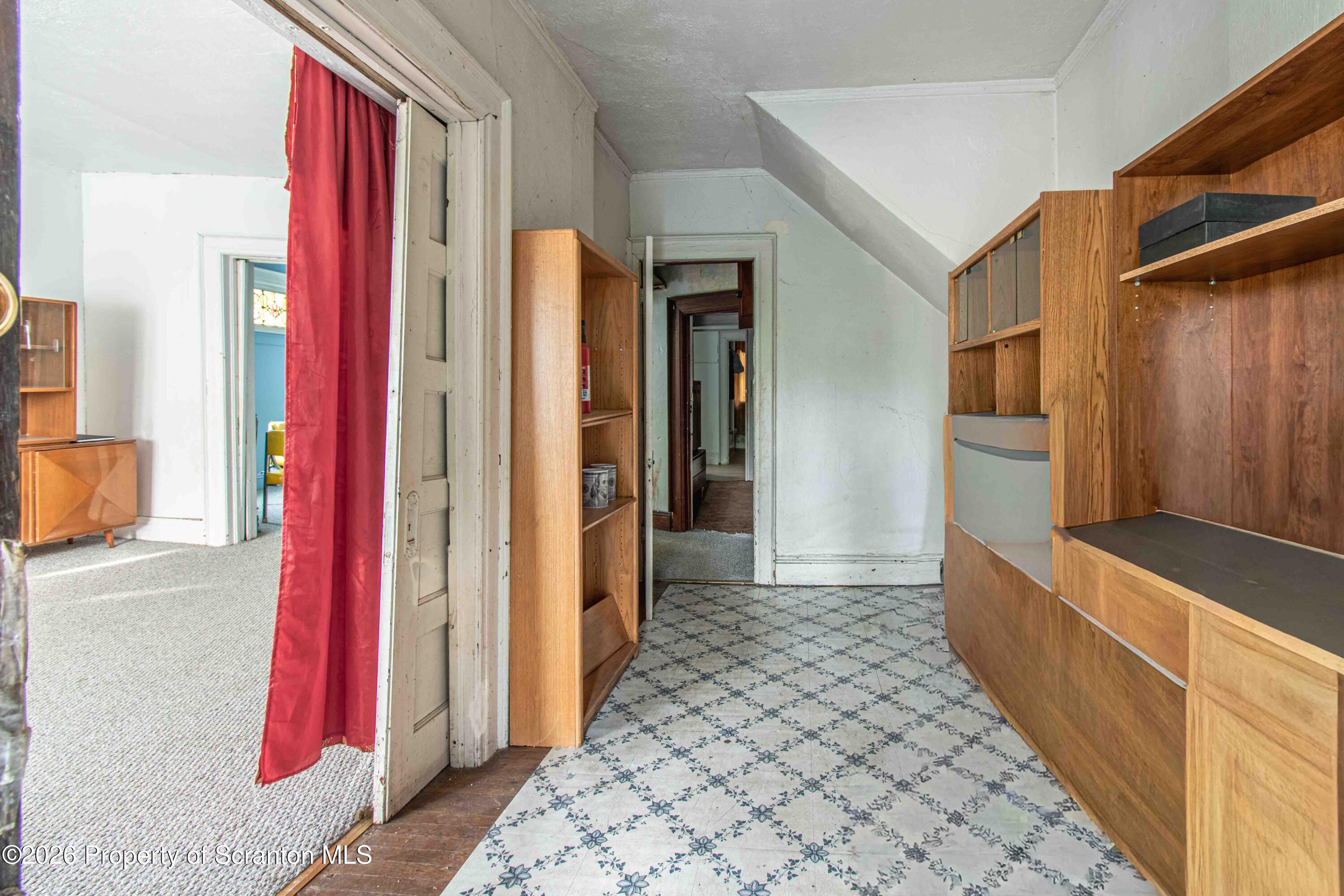 844 Monroe Avenue, Unit 844 Scranton, PA 18510 - Photo 4 of 15 a hallway with a large window and entryway