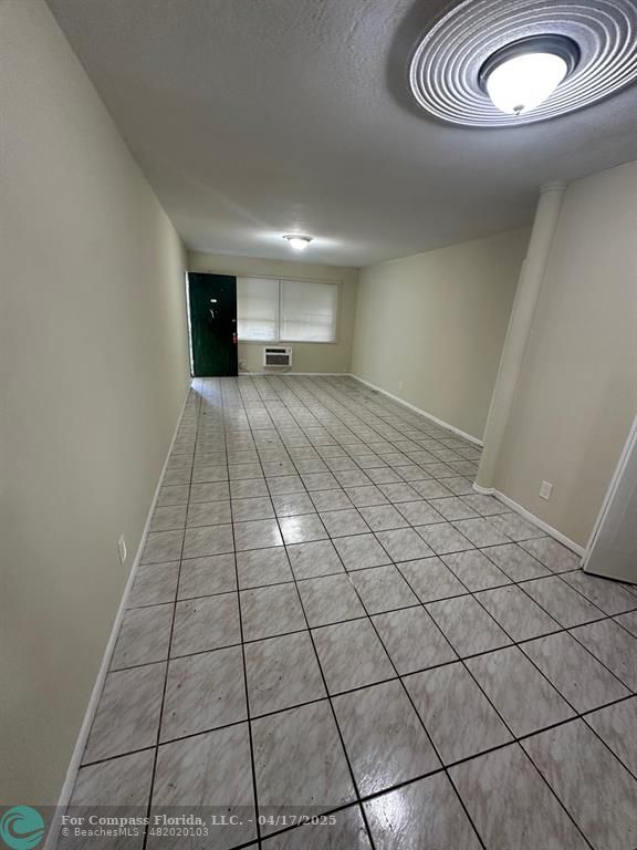 1350 East Sample Road, Unit 101 Pompano Beach, FL 33064 - Photo 4 of 8 a view of empty room