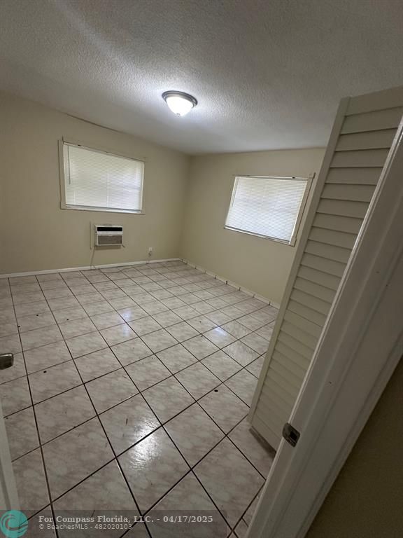 1350 East Sample Road, Unit 101 Pompano Beach, FL 33064 - Photo 5 of 8 a view of a livingroom and window