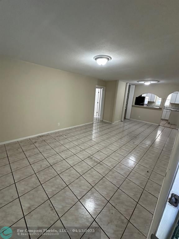 1350 East Sample Road, Unit 101 Pompano Beach, FL 33064 - Photo 6 of 8 a view of a hallway