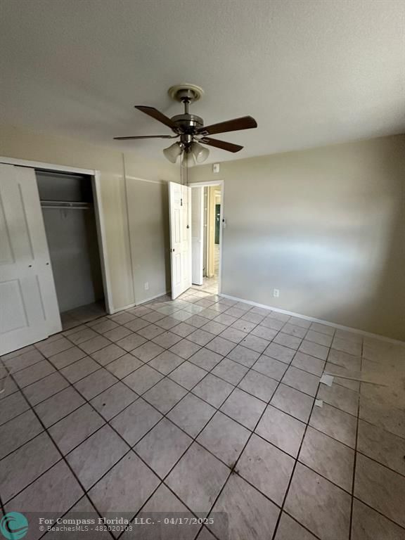 1350 East Sample Road, Unit 101 Pompano Beach, FL 33064 - Photo 7 of 8 a view of a livingroom and a window